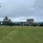 Panoramic view of a lush green golf course at Ala Wai Golf Course. Smooth