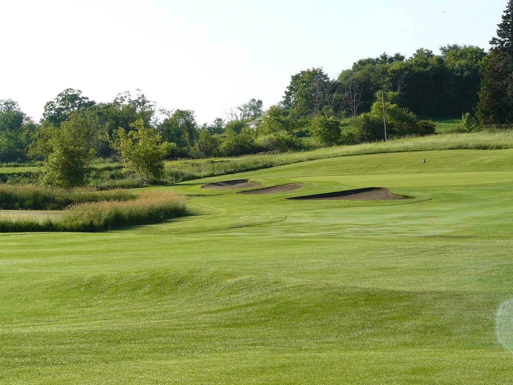 Panoramic view of a lush green golf course at Albion Ridges Golf Course. Smooth