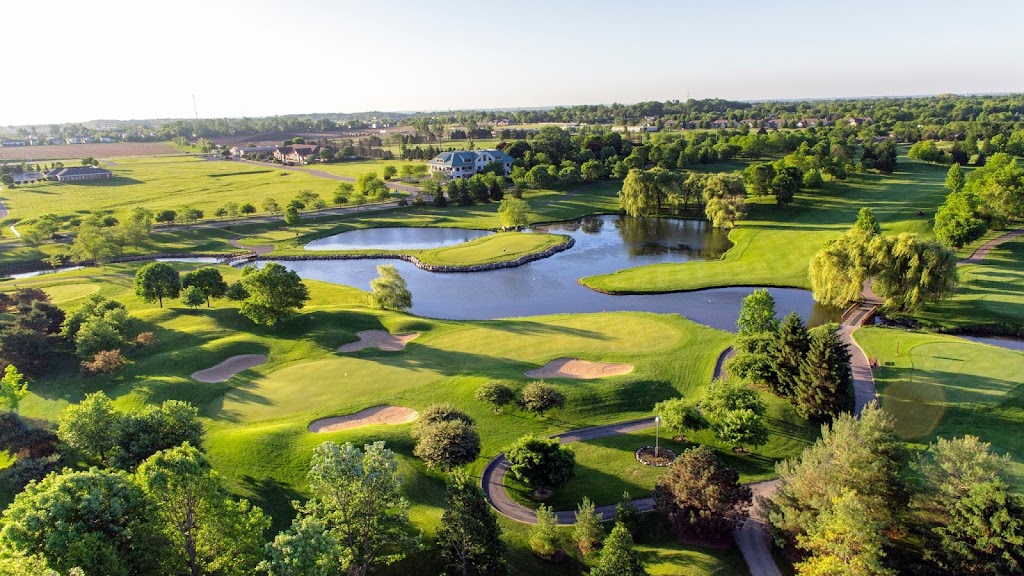 Panoramic view of a lush green golf course at Aldeen Golf Club. Smooth