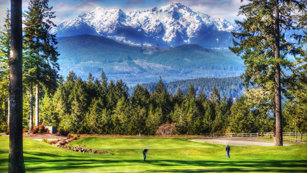 Panoramic view of a lush green golf course at Alderbrook Golf and Yacht Club. Smooth
