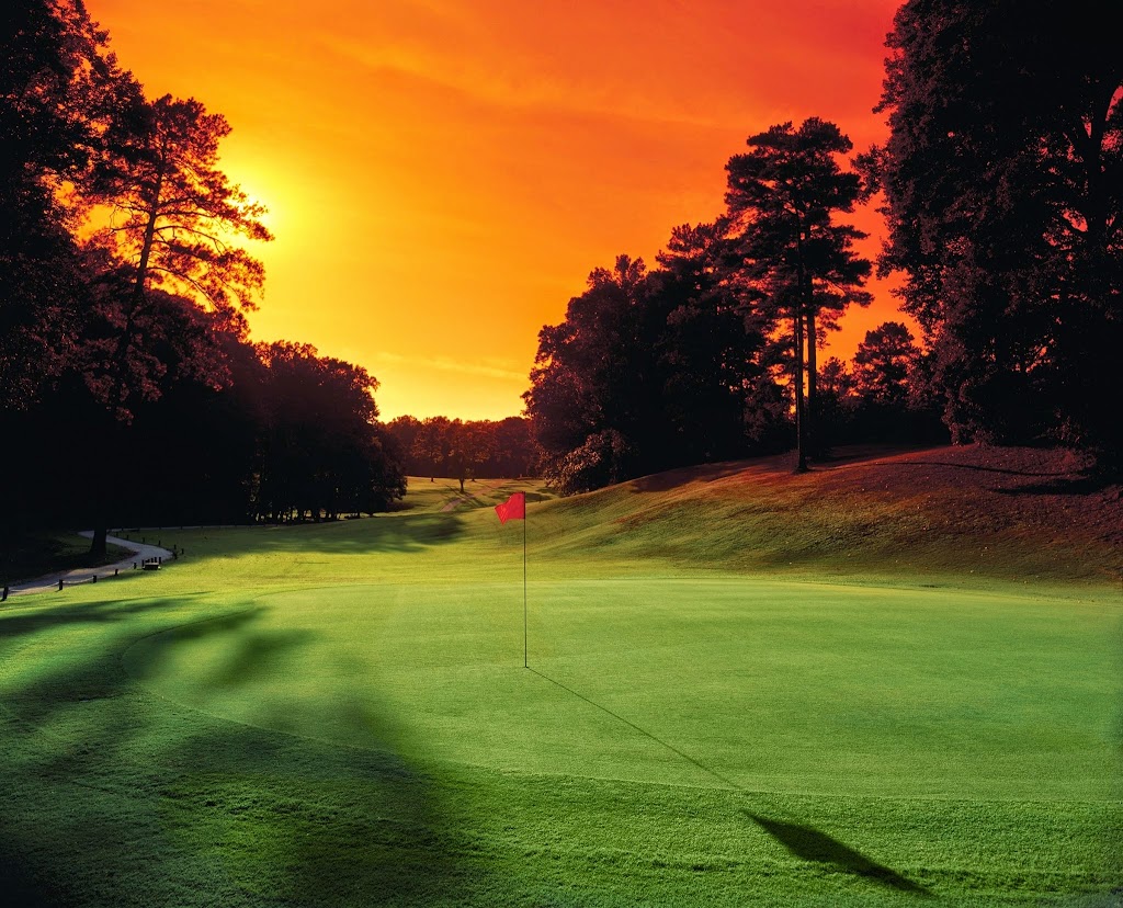 Panoramic view of a lush green golf course at Alfred Tup Holmes Golf Course. Smooth