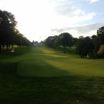 Panoramic view of a lush green golf course at Algonquin Golf Club. Smooth