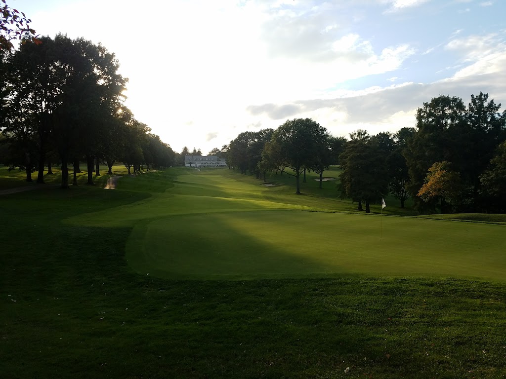 Panoramic view of a lush green golf course at Algonquin Golf Club. Smooth