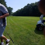 green grass with the flag in the hole.