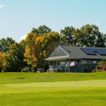 Panoramic view of a lush green golf course at Allendale Country Club. Smooth