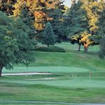 Panoramic view of a lush green golf course at Allenmore Golf Course. Smooth