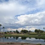 Panoramic view of a lush green golf course at Alta Mesa Golf Club. Smooth