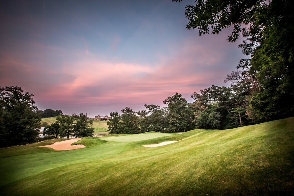 Panoramic view of a lush green golf course at Amana Colonies Golf Club. Smooth
