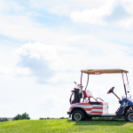Panoramic view of a lush green golf course at American Classic Golf Club. Smooth