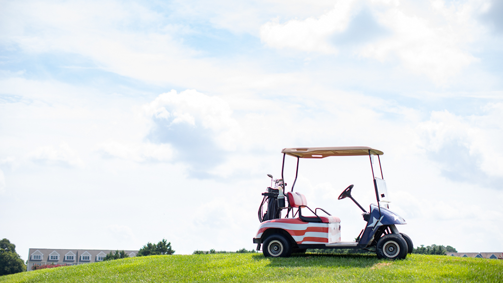 Panoramic view of a lush green golf course at American Classic Golf Club. Smooth