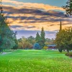 Panoramic view of a lush green golf course at Ancil Hoffman Golf Course. Smooth