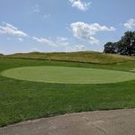 Panoramic view of a lush green golf course at Angels Crossing Golf Club. Smooth