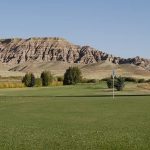 Panoramic view of a lush green golf course at Antelope Hills Golf Course. Smooth