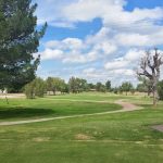 Panoramic view of a lush green golf course at Anthony Country Club. Smooth