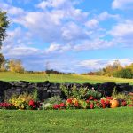 Panoramic view of a lush green golf course at Apple Island Resort Golf Clubhouse. Smooth