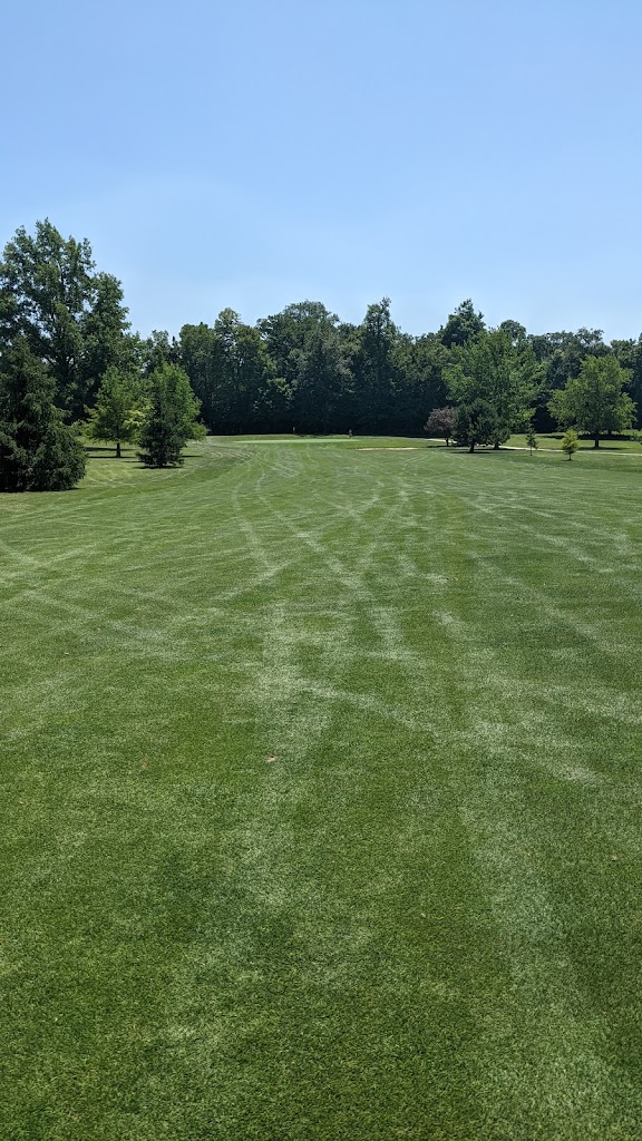 Panoramic view of a lush green golf course at Arbor Trace Golf Club. Smooth
