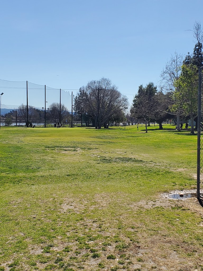 Panoramic view of a lush green golf course at Arcadia Golf Course. Smooth