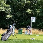 green grass with the flag in the hole.