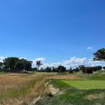 Panoramic view of a lush green golf course at Arcola Country Club. Smooth