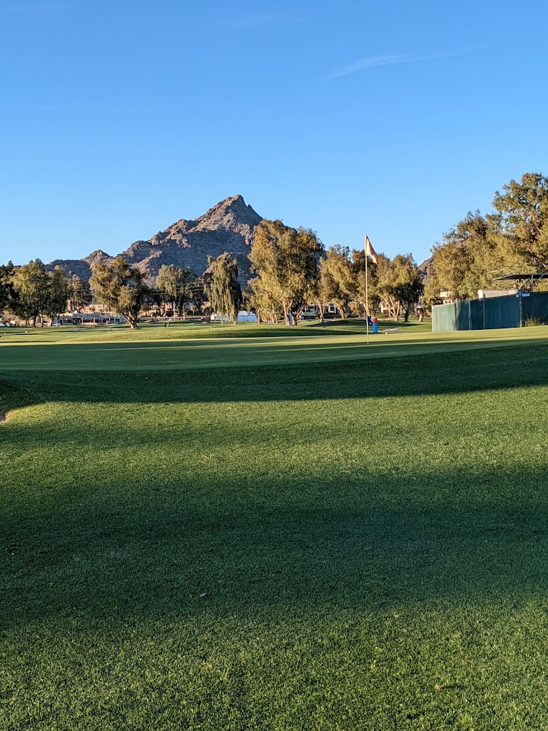 Panoramic view of a lush green golf course at Arizona Biltmore Golf Club. Smooth