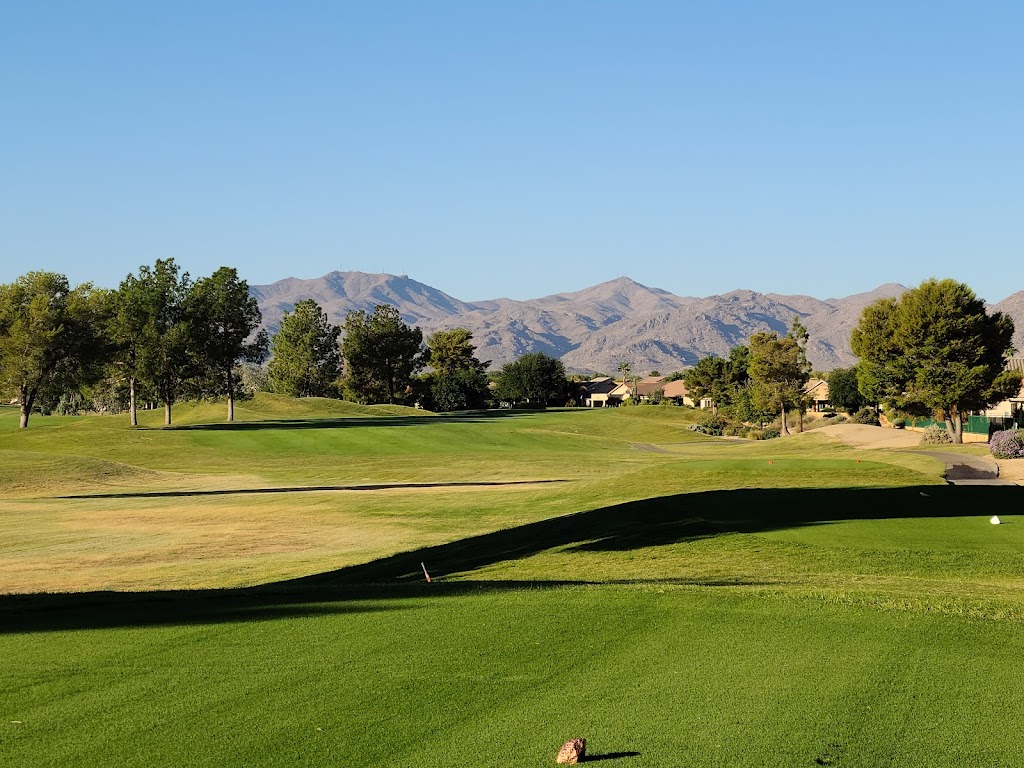 Panoramic view of a lush green golf course at Arizona Traditions Golf Club. Smooth