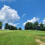 Panoramic view of a lush green golf course at Armitage Golf Club. Smooth