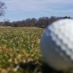 green grass with the flag in the hole.