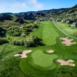 Panoramic view of a lush green golf course at Arrowhead Golf Course. Smooth