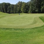 Panoramic view of a lush green golf course at Arrowhead Golf Course. Smooth