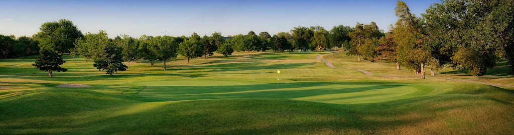 Panoramic view of a lush green golf course at Arthur B. Sim Golf Course. Smooth