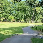 Panoramic view of a lush green golf course at Asheboro Municipal Golf Course. Smooth