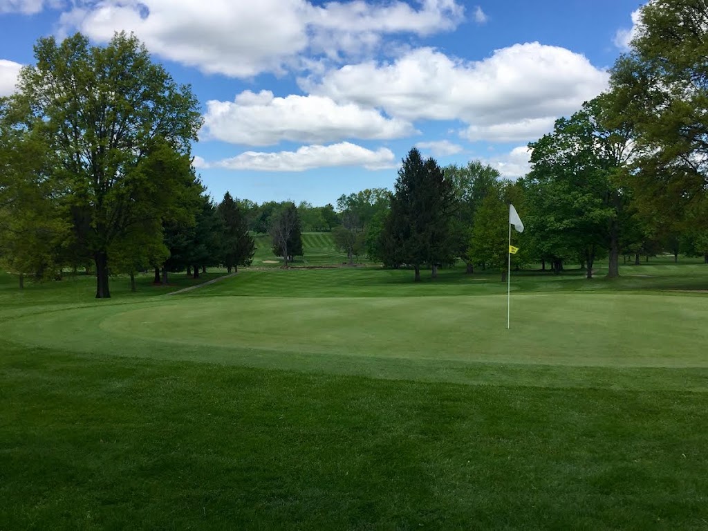 Panoramic view of a lush green golf course at Ashland Golf Club. Smooth