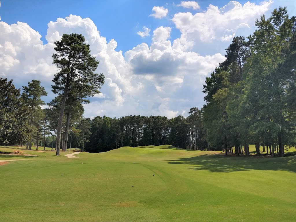 Panoramic view of a lush green golf course at Ashton Hills Golf Club. Smooth