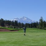 green grass with the flag in the hole.