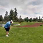 Panoramic view of a lush green golf course at Aspen Lakes Golf Course. Smooth