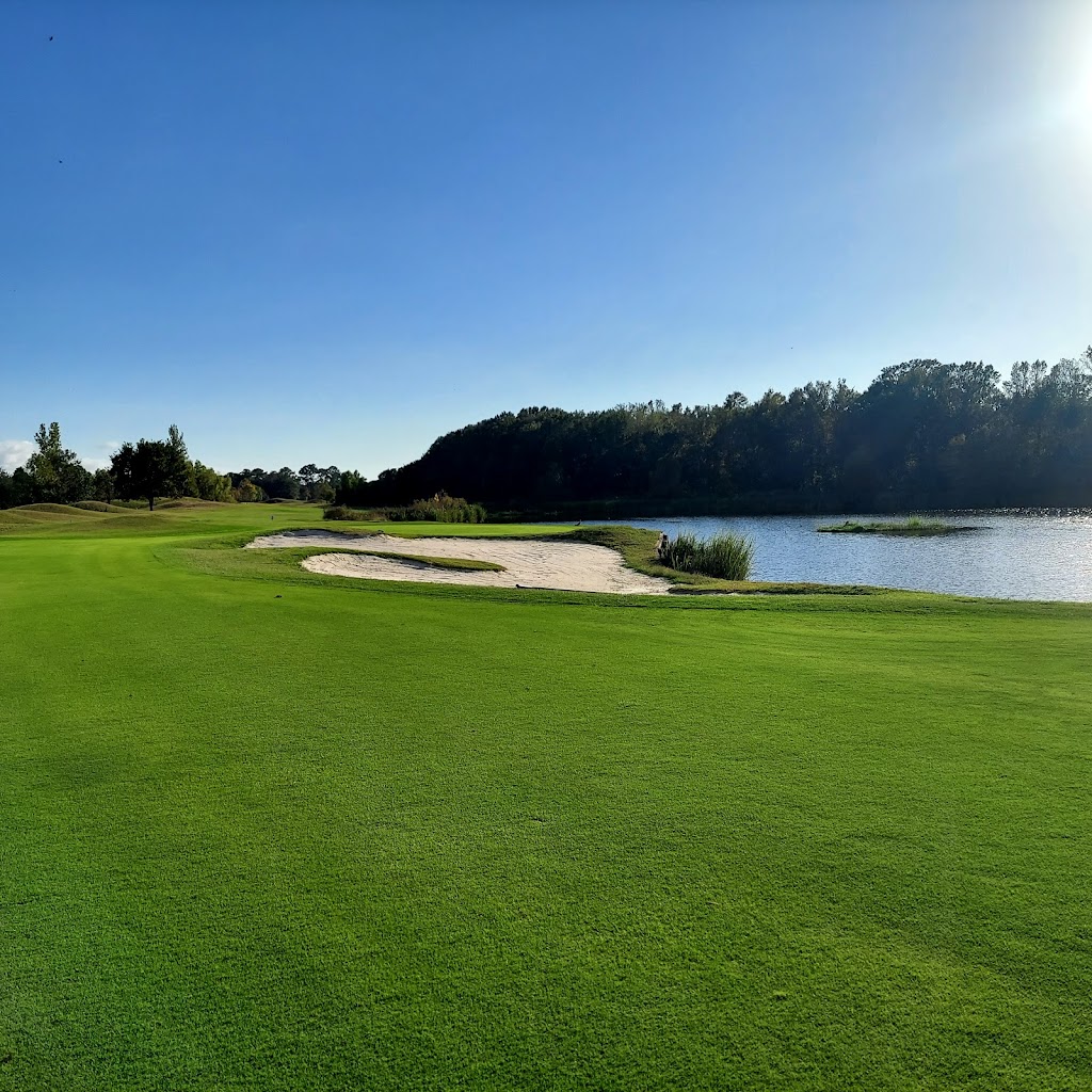 Panoramic view of a lush green golf course at Atchafalaya Golf Course. Smooth