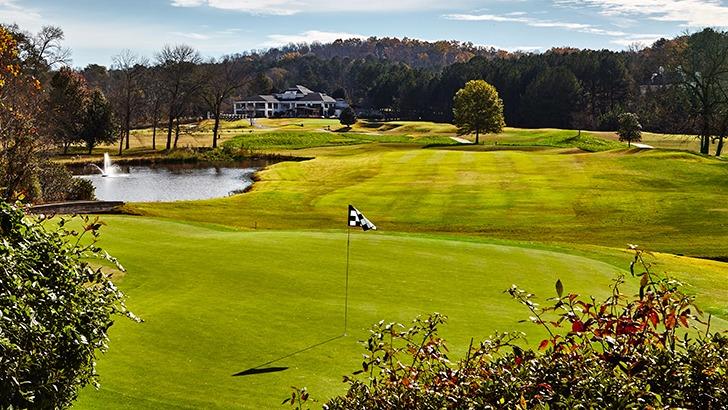 Panoramic view of a lush green golf course at Atlanta National Golf Club. Smooth