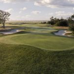 Panoramic view of a lush green golf course at Atlantic City Country Club. Smooth