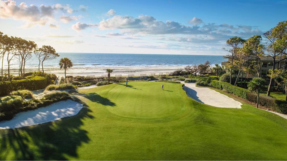 Panoramic view of a lush green golf course at Atlantic Dunes by Davis Love III. Smooth