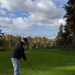 green grass with the flag in the hole.