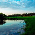 Panoramic view of a lush green golf course at Auburn Hills Golf Course. Smooth