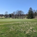 Panoramic view of a lush green golf course at Audubon Country Club. Smooth