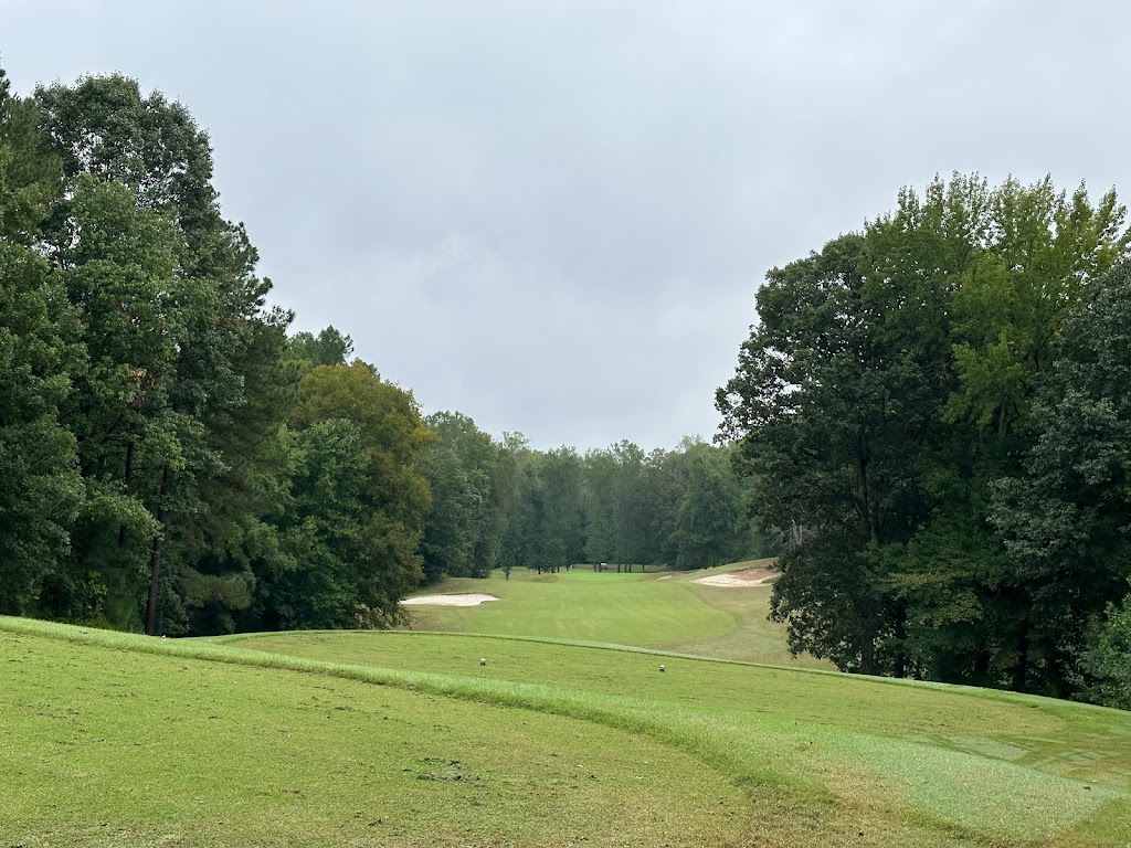 Panoramic view of a lush green golf course at Augustine Golf Club. Smooth
