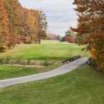 Panoramic view of a lush green golf course at Autumn Ridge Golf Course Inc. Smooth