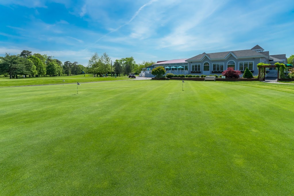 Panoramic view of a lush green golf course at Avalon Golf Club. Smooth