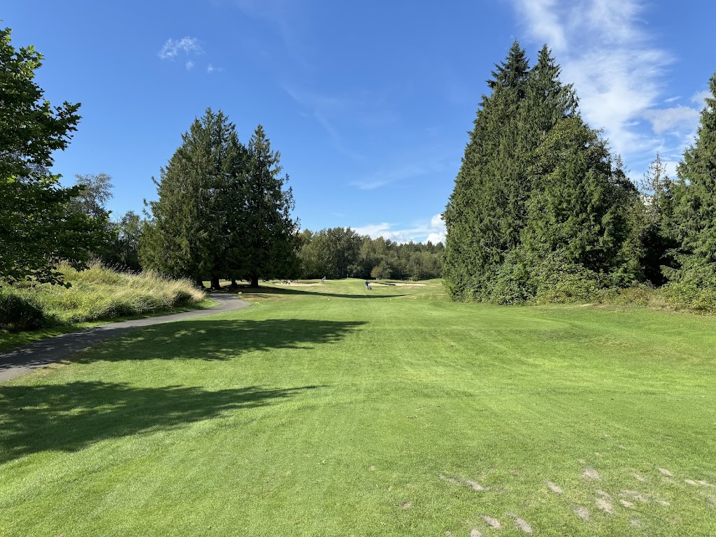 Panoramic view of a lush green golf course at Avalon Golf Links. Smooth
