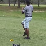 green grass with the flag in the hole.