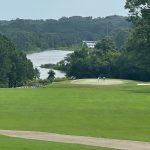 Panoramic view of a lush green golf course at Azelea City Golf Course Club House Cafe. Smooth