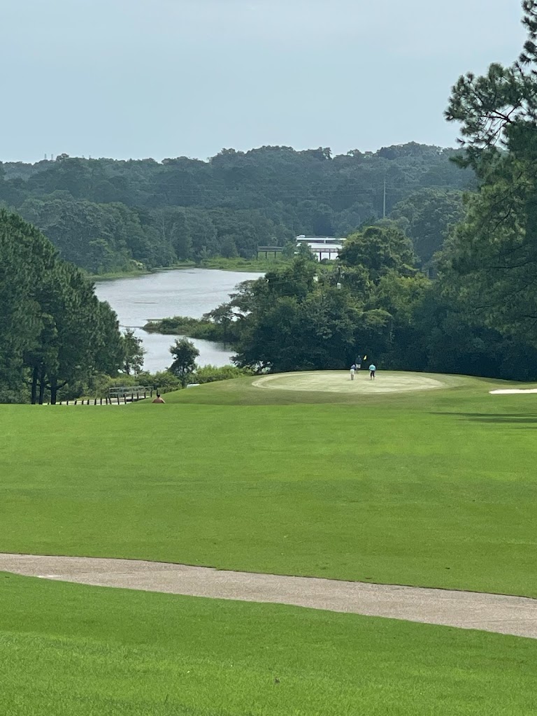 Panoramic view of a lush green golf course at Azelea City Golf Course Club House Cafe. Smooth