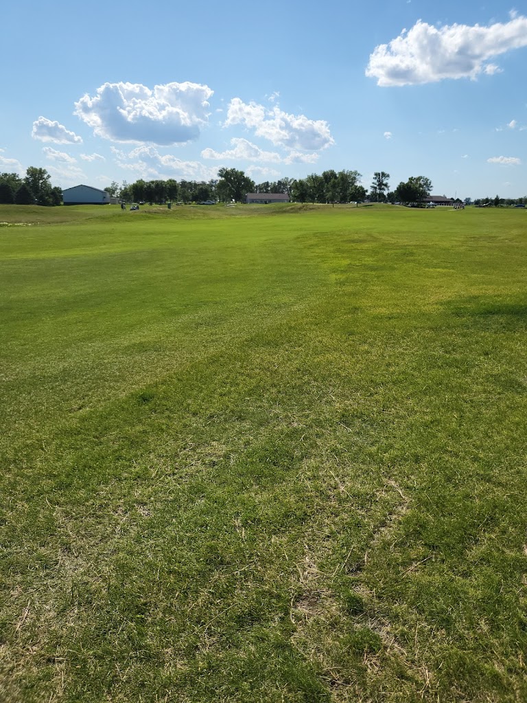 Panoramic view of a lush green golf course at Bakker Crossing Golf Course. Smooth